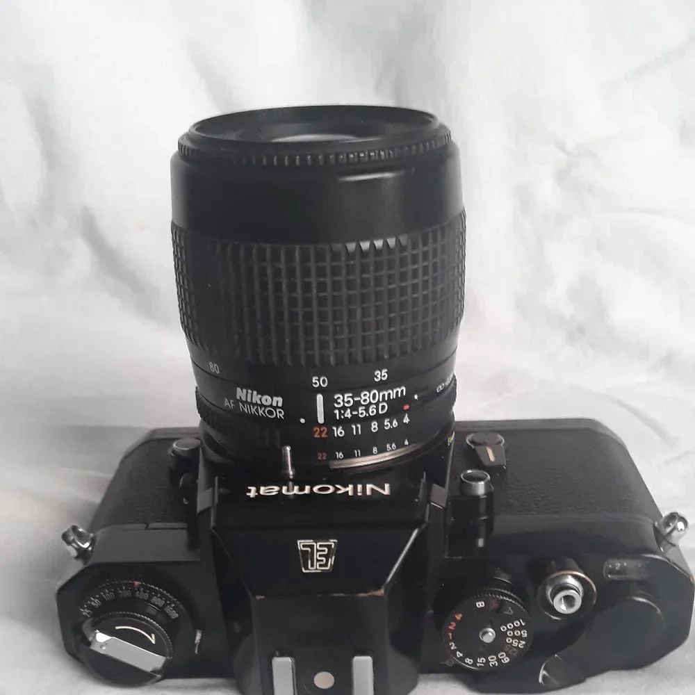 Nikon Nikkomat EL Nikkor 35-80mm 4-5.6D Zoom lens. Leather case